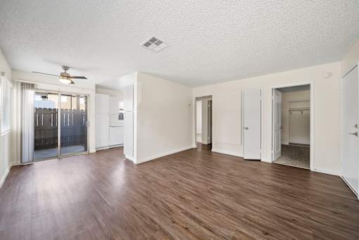 A room with wooden floors and white walls.