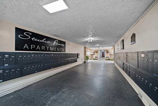 A long hallway with Studio Pointe Apartments written on the wall.