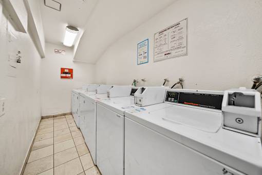 A laundromat with washers and dryers.