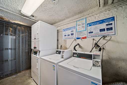 A room with industrial equipment and signs on the wall.