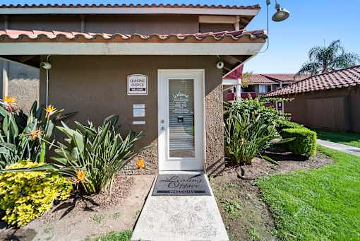 A small building with a sign that says "Leasing Office" on it.