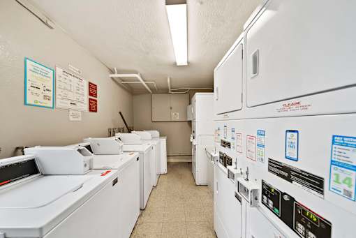 A row of washing machines in a laundromat.