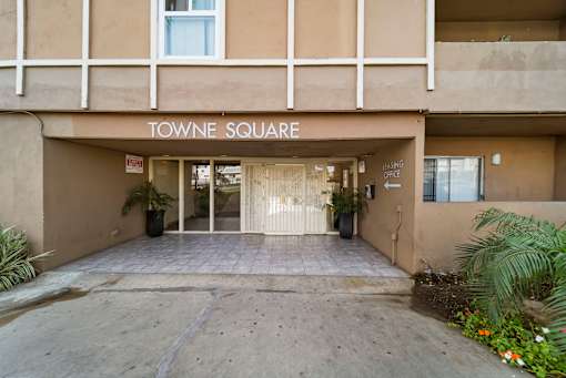 Towne Square building entrance with a sign above the door.