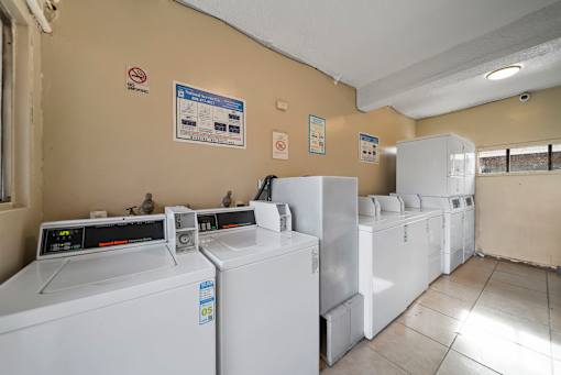 A laundromat with washers and dryers.
