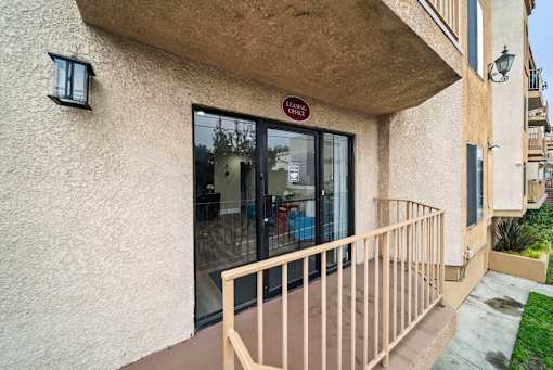 A building with a red sign on the door.