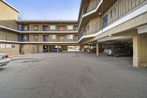A parking garage with cars parked in it.