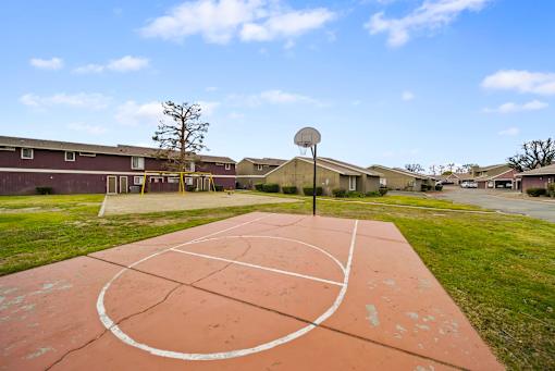 A basketball court with a basketball hoop and a basketball net.