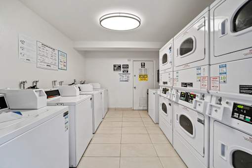 A row of washing machines in a laundromat.