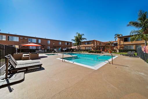 A pool area with a clear blue sky above.