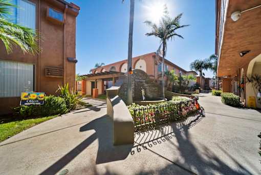 A sunny day at a residential area with a clear blue sky.