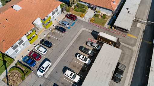 A parking lot with cars parked in it.