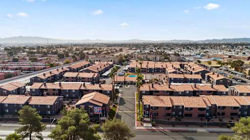 A view of a residential area with houses and a road.