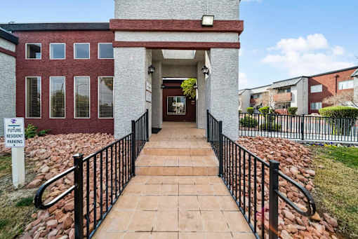 A brick building with a sign that says "Future Resident Parking" in front of it.