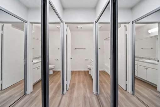 A spacious bathroom with a vanity and a toilet.