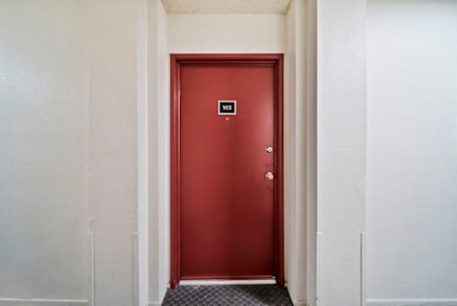 A red door with a number 10 on it.