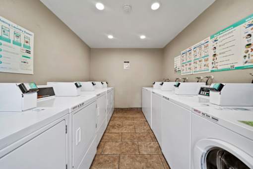 A laundromat with rows of washers and dryers.