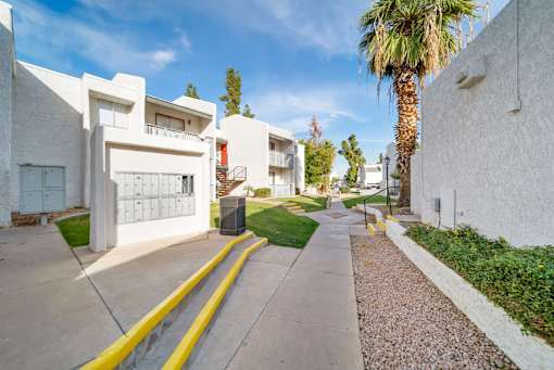 A white building with a yellow line in front of it.