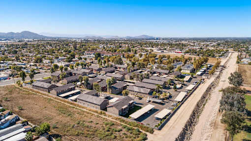 A bird's eye view of a residential area with houses and a road.