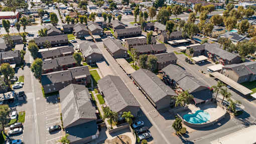 A residential area with houses and a swimming pool.