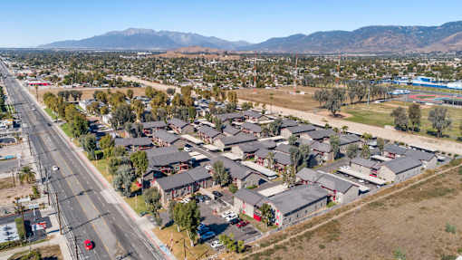 A suburban area with houses and a road.