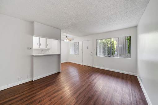 A room with wooden floors and white walls.