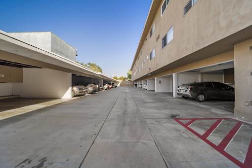 A parking garage with a car parked in the first level.