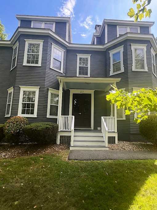 A house with a blue exterior and white trim.