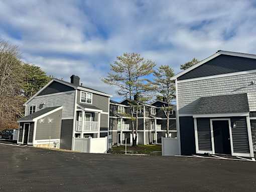 a row of houses with a parking lot