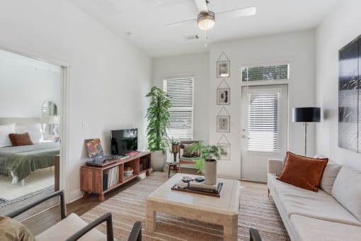 Living room with a couch and a coffee table at Arcadia Decatur, Decatur, Georgia, 30030.