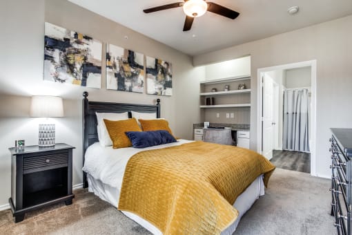 a bedroom with a bed and a ceiling fan at Village of Hawks Creek Apartments, Westworth Village, 76114