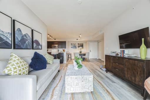 Living room with a couch and a coffee table and a tv at The Atlantic at Tradition, Port St Lucie, FL, 34987