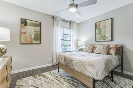 Bedroom with a large bed and a window at The Atlantic Preserve, Plantation, FL