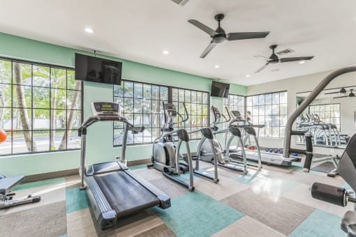 Gym with treadmills and other exercise equipment  at The Atlantic Preserve, Plantation, FL 33322