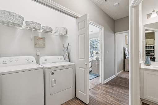 A laundry room with a washer and dryer at The Atlantic Canton Ridge, Georgia