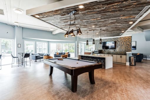 a game room with a pool table and a tv at Harrison Grande, Cary, NC