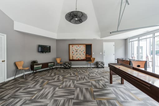 a living room with a pool table and a tv  at Harrison Grande, Cary, North Carolina