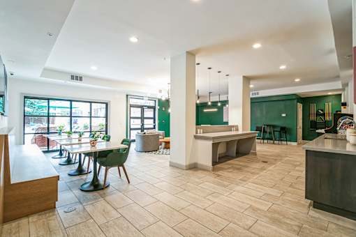 A spacious room with a long table and chairs at The Atlantic Buckhead Apartments, Atlanta, GA