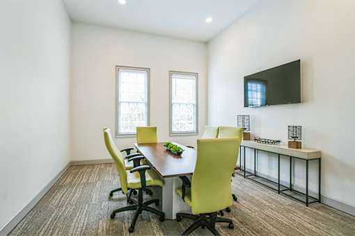 A conference room with a long table and chairs at The Atlantic Buckhead Apartments, Georgia