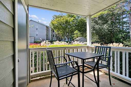 Patio with a table and chairs on a balcony at The Atlantic Ashford, Atlanta, Georgia