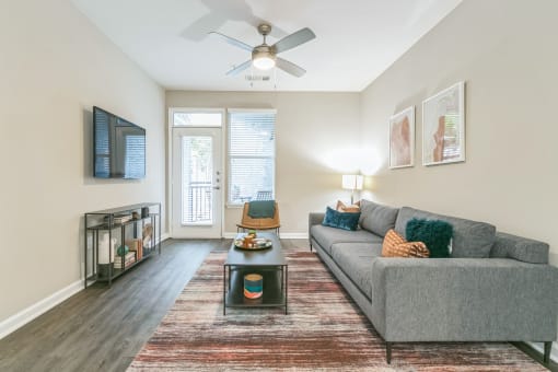 Living room with a couch at The Atlantic North Highland, Charlotte