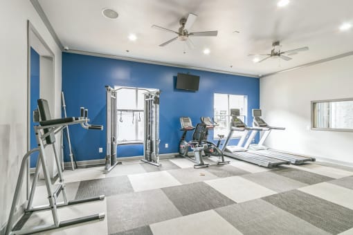 Gym with treadmills and weights at The Atlantic North Highland, Charlotte