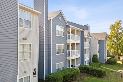 Apartment buildings with balconies and a clear sky in the background at Magnolia Terrace Apartments, Charlotte, 28213