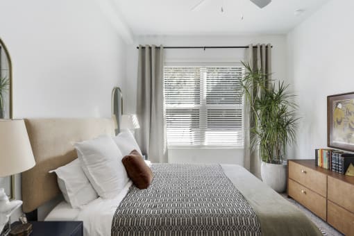 Master bedroom with a king size bed at Arcadia Decatur, Decatur, Georgia, 30030.