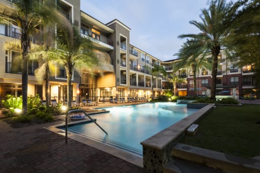 Resort-Inspired Pool with Sun Ledge, Lap Pool, and Waterfall. at The Atlantic Memorial, Houston, Texas