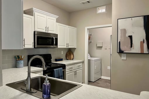 Kitchen and Laundry Room at The Atlantic River West, Georgia, 30336