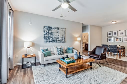 Living room with a couch and a coffee table at The Atlantic Mountain Island, North Carolina, 28216