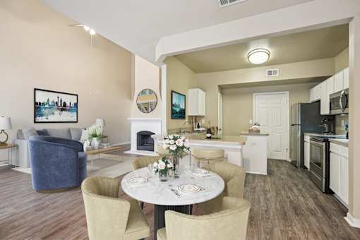 Appearance Of kitchen and living room with sofa set and tables at Reserve at Canyon Creek, San Antonio, TX