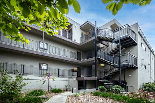 A modern building with a staircase and balconies.