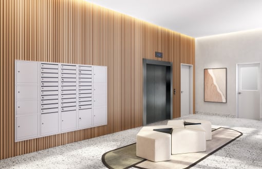 a lobby with chairs and a table and a door