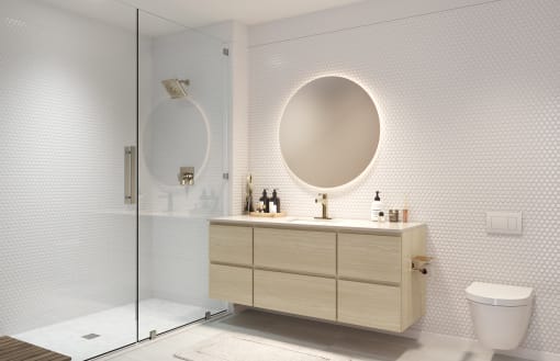 a bathroom with a toilet and a vanity with a mirror